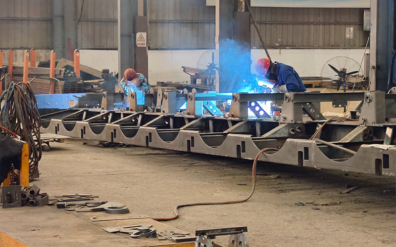 Semi trailer chassis fabrication and assembly in a factory